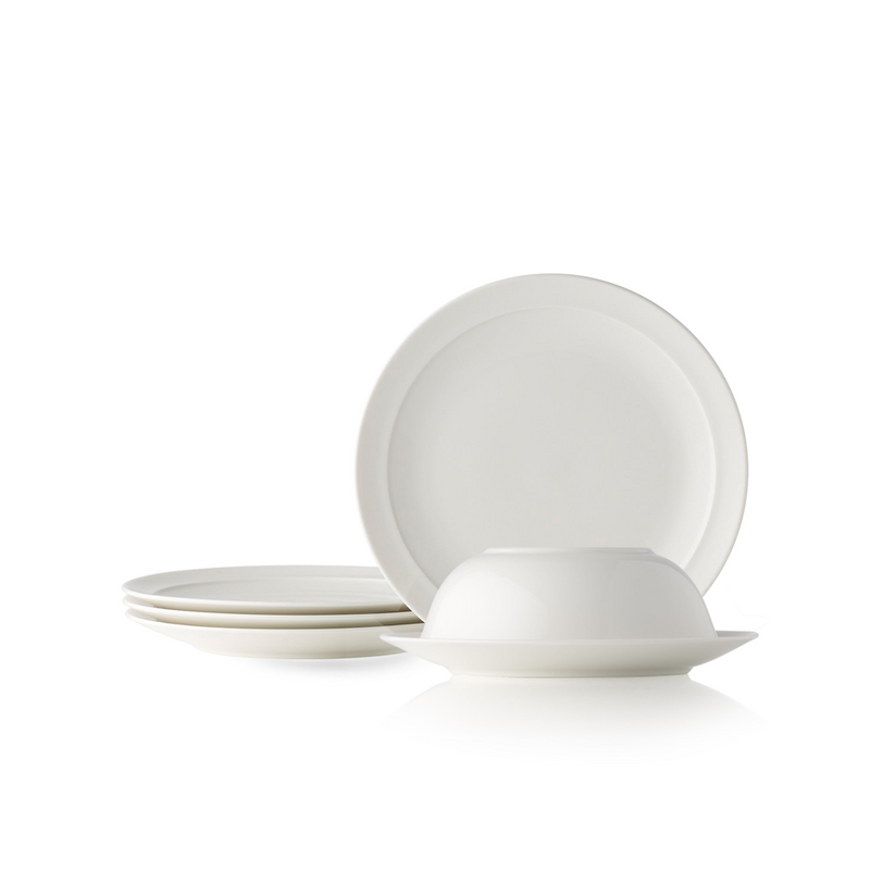 The Adam Liaw Everyday Noritake medium plate and bowl set. The image shows a white porcelain bowl stacked upside down on a plate, with other plates stacked and displayed nearby, against a white background.
