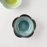 A top-down view of the Aizome Cerulean Bloom Side Bowl, showing its plum blossom shape and calming sky blue glaze.