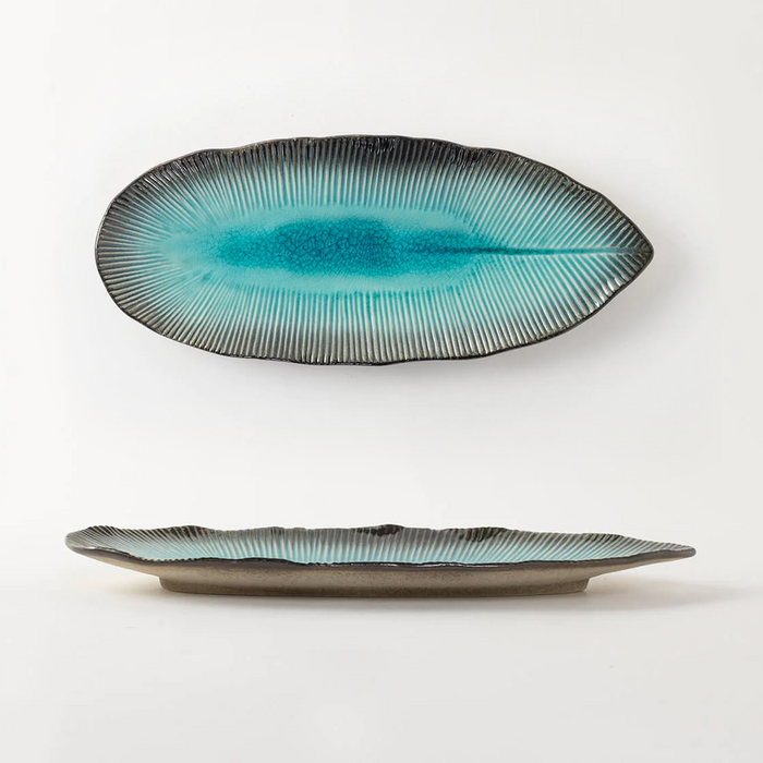 Japanese-inspired leaf-shaped plate with Aizome blue dye design.