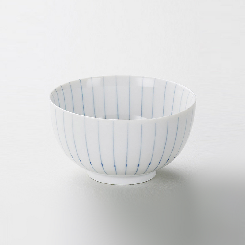 The Aomugi Reed Pattern Chrysanthemum bowl, featuring a white glaze with fine blue vertical pinstripes, shown against a light grey background.
