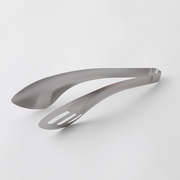 Close-up view of the Aux Leye stainless steel tongs, highlighting the purposeful hole feature.