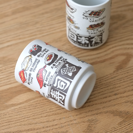 The Beams Japan Sushi Yunomi Teacup, featuring colorful illustrations of various sushi ingredients with their names in Japanese and English.
