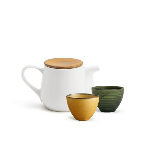 A white ceramic teapot with a wooden lid, accompanied by two small ceramic cups in mustard yellow and olive green from the Tojiki Tonya Bio and Cotto Series.