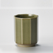 Simple yet elegant olive green ceramic Japanese teacup with a textured crackle finish and nonagon design, displayed on a neutral background.