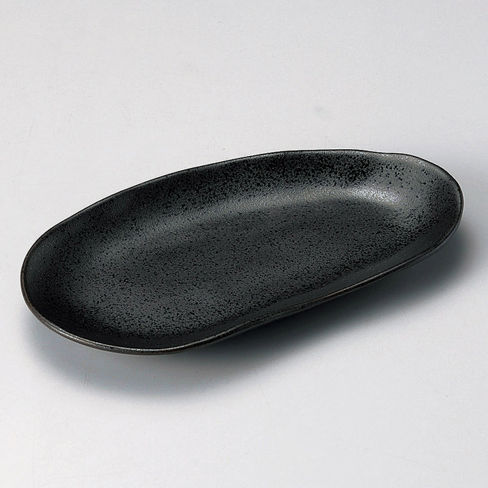 Japanese-made ceramic serving plate in deep black, reflecting an artistic interpretation of a cloud's silhouette.