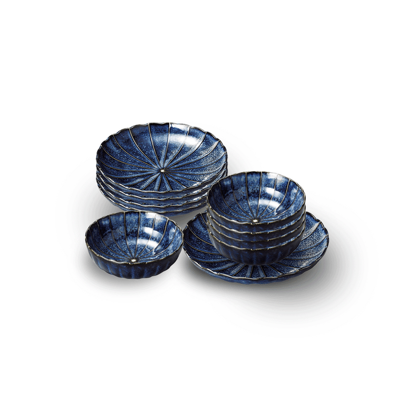 The Yohenkon Ten Grass Chrysanthemum 10-piece dinner set, showing five 23cm plates and five 14cm bowls in a deep blue, kiln-altered glaze.