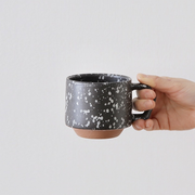 A product shot of the 280ml CHIPS Stack Mug in the Splash Black White colour, showing its angular handle and stepped base.