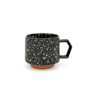 A product shot of the 280ml CHIPS Stack Mug in the Splash Black White colour, showing its angular handle and stepped base.