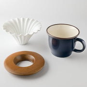Chill Out gift set laid out: ceramic dripper, acacia wood holder and navy 390ml mug