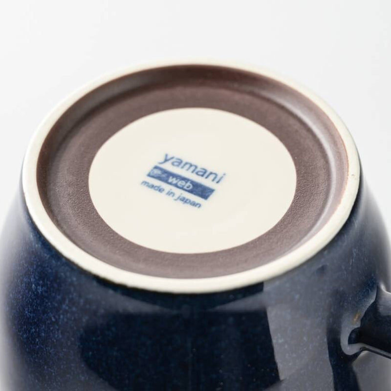 Underside of the Chill Out navy mug showing the maker's stamp