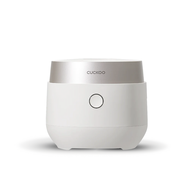 The Cuckoo CR-0685FW 6-cup Micom rice cooker, showing its minimalist white and silver design and simple single-button front panel.
