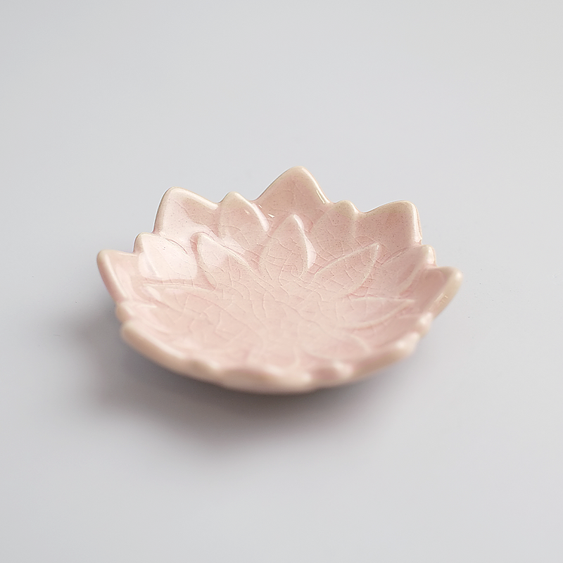 An angled product image of the pink Fiore Dahlia mini plate, showing its delicate flower shape and crackled glaze.

