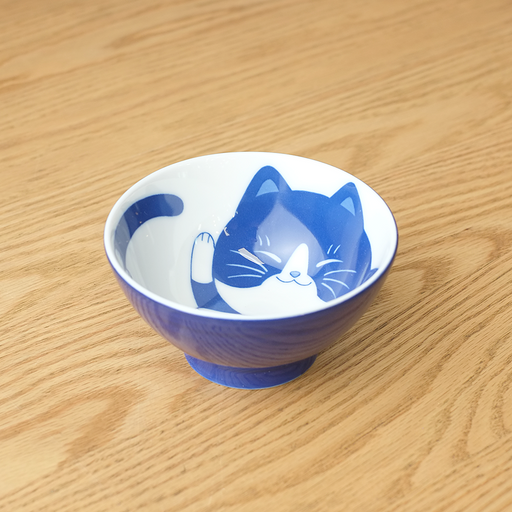 Daitoua Neko Chigura Hachiware Rice Bowl featuring a blue and white illustration of a cat with a distinctive 'hachi' (eight-shaped) mask pattern on its forehead inside the bowl.