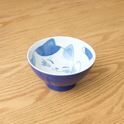 Daitoua Neko Chigura Mike (Calico) Rice Bowl featuring a blue and white illustration of a smiling cat with a spotted pattern inside the bowl.