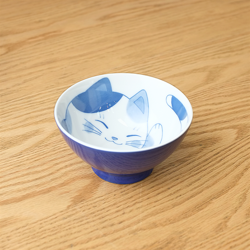 Daitoua Neko Chigura Mike (Calico) Rice Bowl featuring a blue and white illustration of a smiling cat with a spotted pattern inside the bowl.