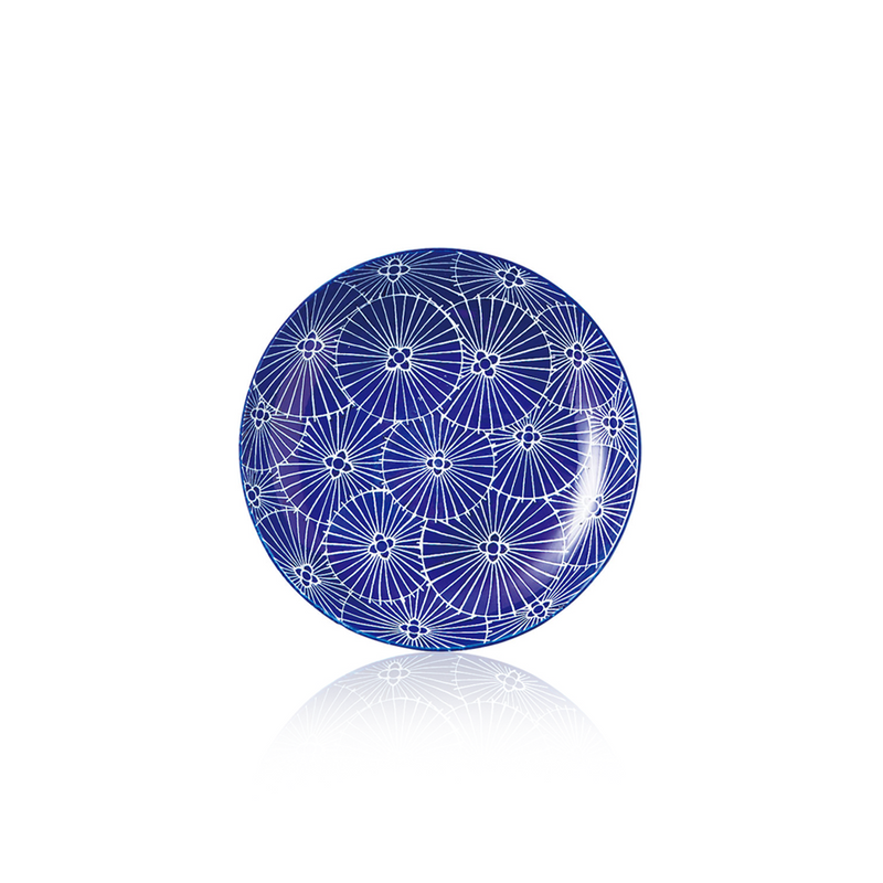 A top-down view of the Daitoua Japanese Umbrella Dinner Plate, showing the intricate white umbrella pattern on a deep blue background.