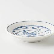Side profile of the Edokko Dinosaur Hiyakuryu mini plate, highlighting its shallow curved rim and white porcelain body.