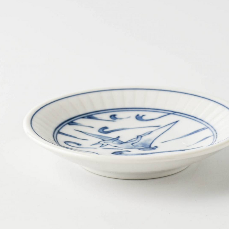 Side profile of the Edokko Dinosaur Hiyakuryu mini plate, highlighting its shallow curved rim and white porcelain body.