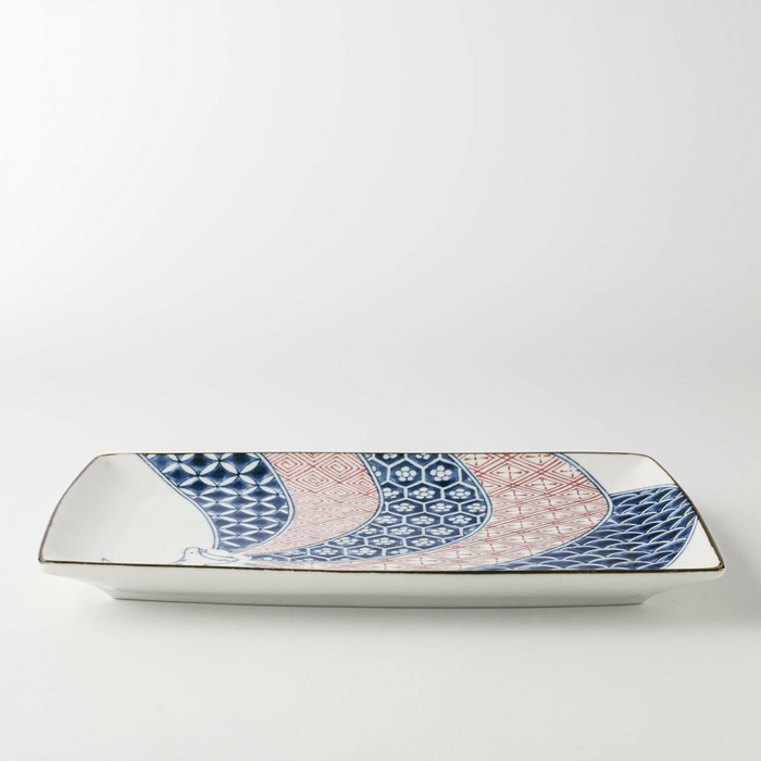 Side view of the Edokko Dinosaur Rectangular Serving Plate highlighting its gently curved edges and balanced structure.