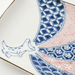 Close-up of the Edokko Dinosaur Rectangular Serving Plate’s detailed geometric patterns and the whimsical dinosaur illustration.
