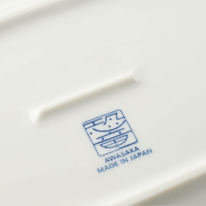 Bottom of the Edokko Dinosaur Rectangular Serving Plate with the Awasaka brand logo and "Made in Japan" marking.