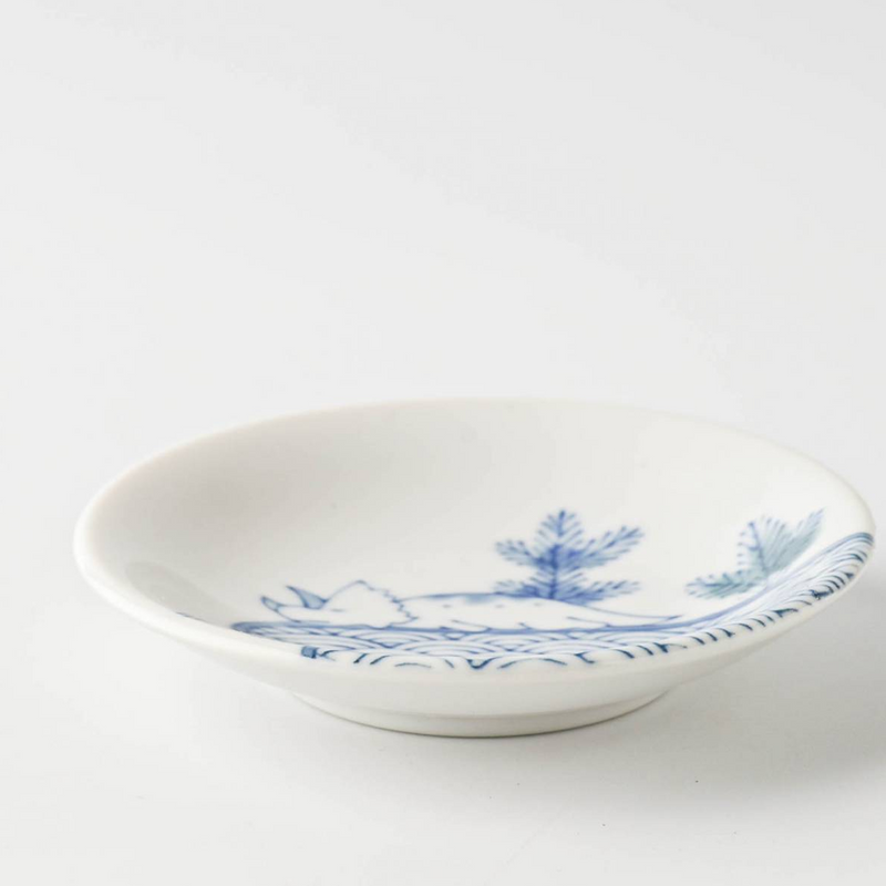 An angled view of the Edokko Dinosaur Seigairyu mini plate, showing its blue and white wave and triceratops design.

