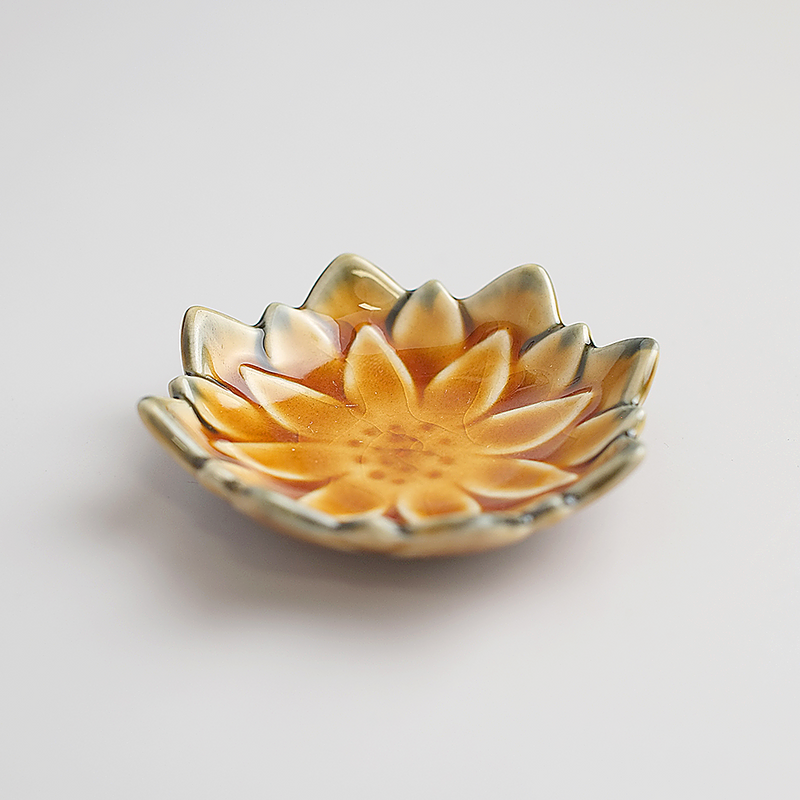 An angled product image of the Fiore Dahlia mini plate in the Autumn Brown colourway, showing its flower shape and crackled glaze.


