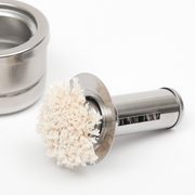 Close-up of the stainless steel oil basting brush with soft, absorbent bristles for smooth oil application.
