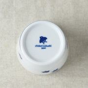 Bottom view of a white ceramic cup, showcasing the manufacturer's mark "chidori zukushi japan" in blue on its base.
