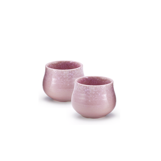 Set of two Fuki Momoyama sake cups, elegantly designed with a smooth pink gradient and a speckled pattern resembling cherry blossoms. The cups have a rounded, bulbous shape, perfect for holding and savoring sake.