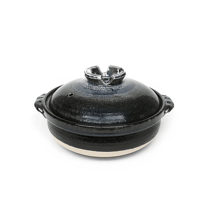 Japanese black-glazed Donabe clay pot with a fitted lid.