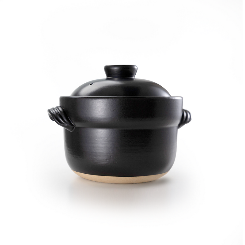 A product image of the Iga-yaki Goemon Donabe Rice Pot, showcasing its semi-matte black glaze, traditional shape, and twisted clay handles.