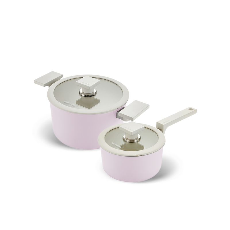 The Happycall Meister Edge 2-piece ceramic pot set in a pastel lavender finish, showing the 16cm saucepan and 20cm pot with matching glass lids and modern grey handles.


