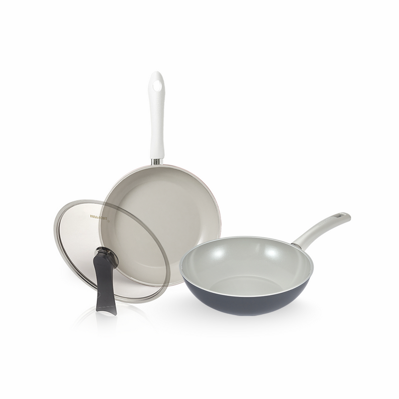 The Happycall 3-piece ceramic nonstick cookware set, including a 28cm frypan, a 28cm wok, and a self-standing glass lid, displayed on a white background.

