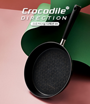 Top view of Happycall Crocodile Direction Frypan featuring geometric nonstick surface and black handle on a coloured background.


