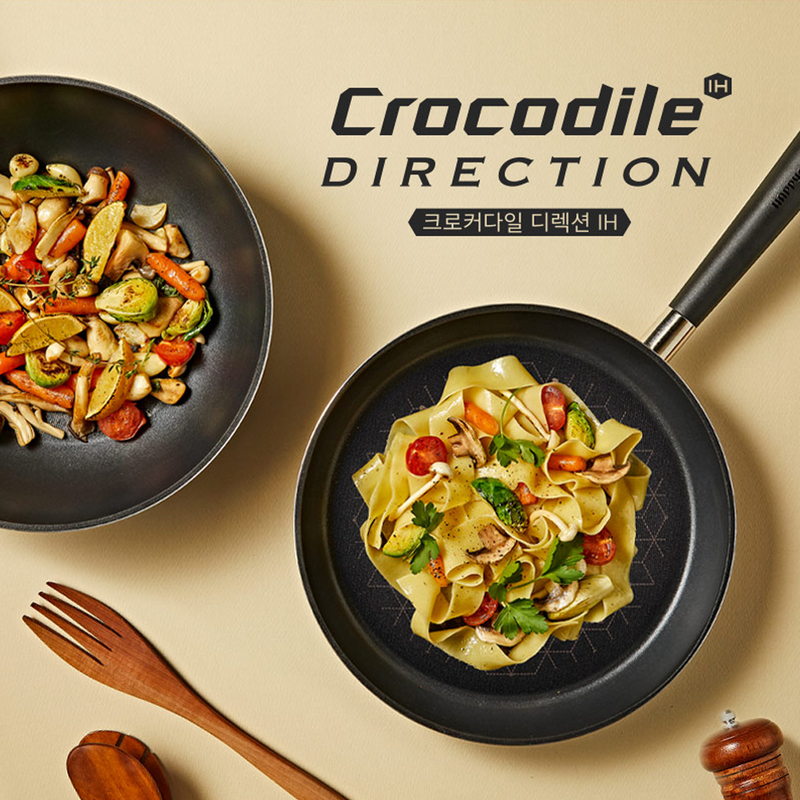 Cooked pasta and vegetables in Happycall Crocodile Direction pans demonstrating use in food presentation.

