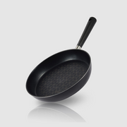Angled view of the Happycall Crocodile Direction frypan with geometric graphene pattern inside.

