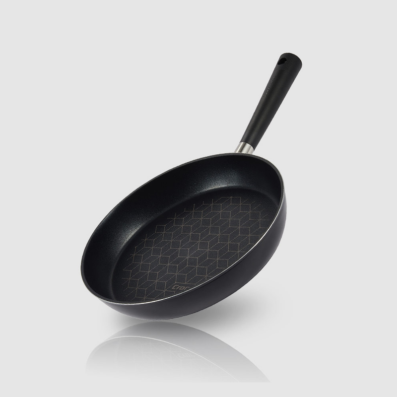 Angled view of the Happycall Crocodile Direction frypan with geometric graphene pattern inside.

