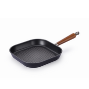 The 28cm square Happycall Crocodile Graphene nonstick induction grill pan, showing its raised grilling ridges and wood-style handle, angled on a white background.
