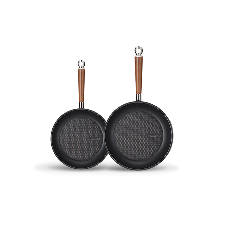 The 2-piece Happycall Crocodile Graphene nonstick induction frypan set, showing the 24cm and 28cm frypans with their hexagonal patterned surfaces and wood-style handles.