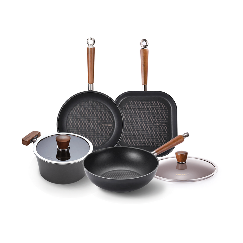 The 6-piece Happycall Crocodile Graphene cookware set, including a frypan, grill pan, wok, and pot with lids, featuring distinctive hexagonal patterned surfaces and wood-style handles.







