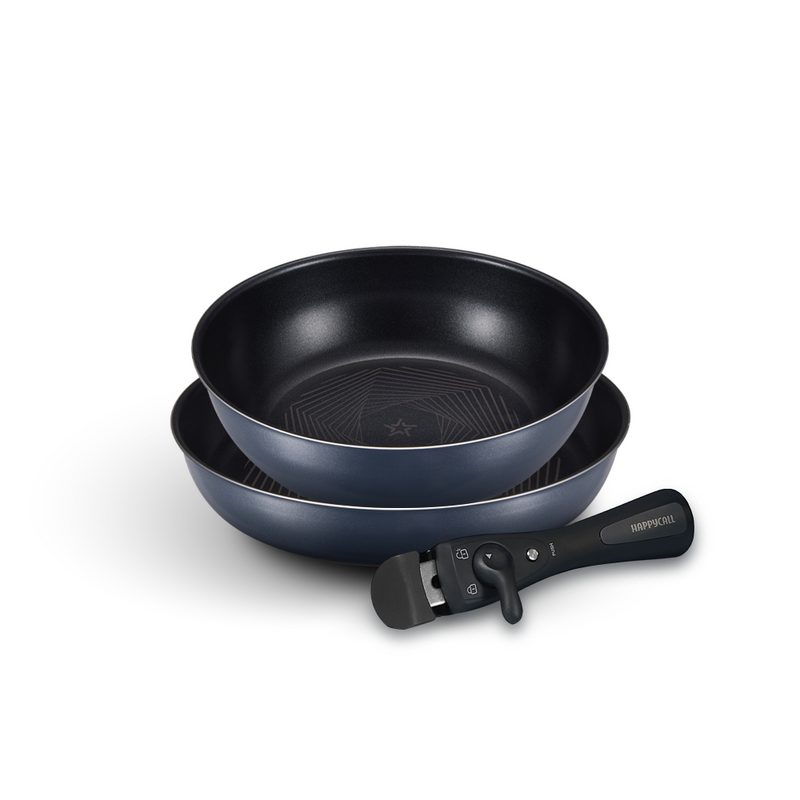 The 3-piece Happycall Freehands Spica cookware set, showing the 26cm frypan and 26cm wok stacked together, with the black detachable handle in front.
