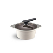 The 20cm Happycall Onde ceramic nonstick induction pot in an ivory finish, shown with its self-standing tinted glass lid and featuring a ridged exterior.
