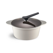The 28cm Happycall Onde ceramic nonstick induction stockpot in an ivory finish, shown with its self-standing tinted glass lid and featuring a ridged exterior.

