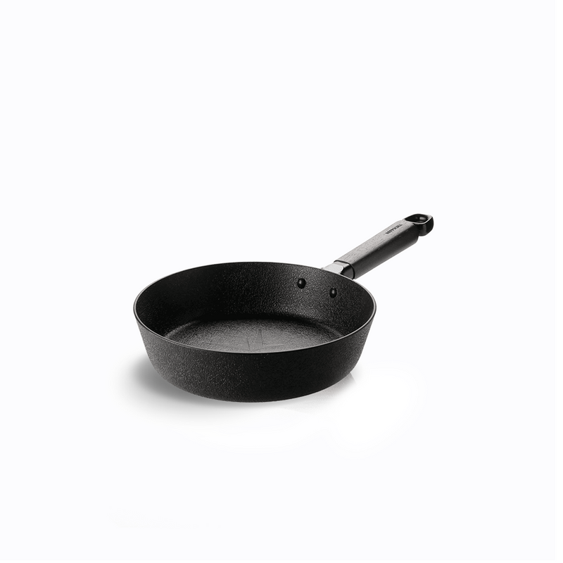 The 22cm Happycall Noire Titanium Plus nonstick induction frypan, showing its unique dark textured 'magma' surface and simple black handle, angled on a white background.
