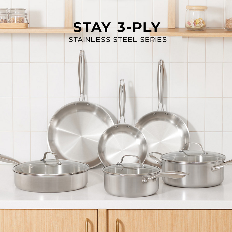 The full Happycall Stay 3-Ply Stainless Steel Series cookware collection displayed on a modern kitchen counter.