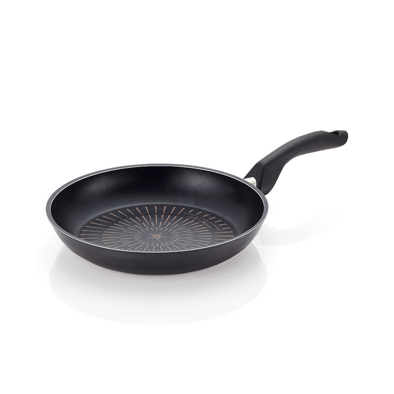 Happycall Plasma Titanium Frypan - Angled View: An angled view of the Happycall Plasma Titanium Frypan placed on a white surface, showcasing the ergonomic handle and the distinctive pattern inside the pan.


