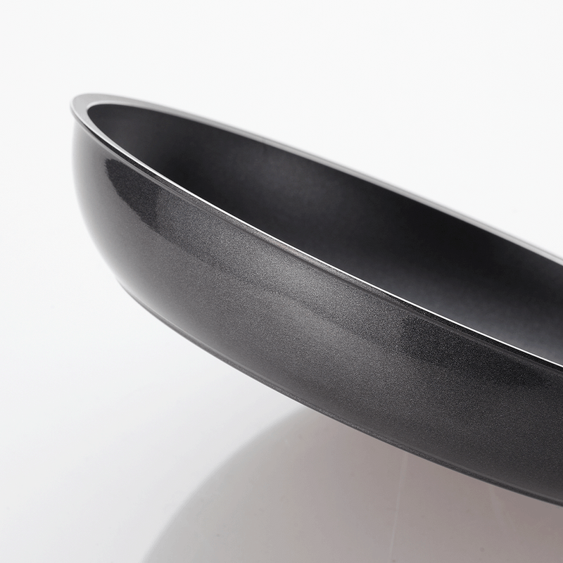 Side View of Happycall Plasma Titanium Frypan: A close-up side view of the Happycall Plasma Titanium Frypan, focusing on the sleek, slightly curved edge and the smooth, nonstick exterior.

