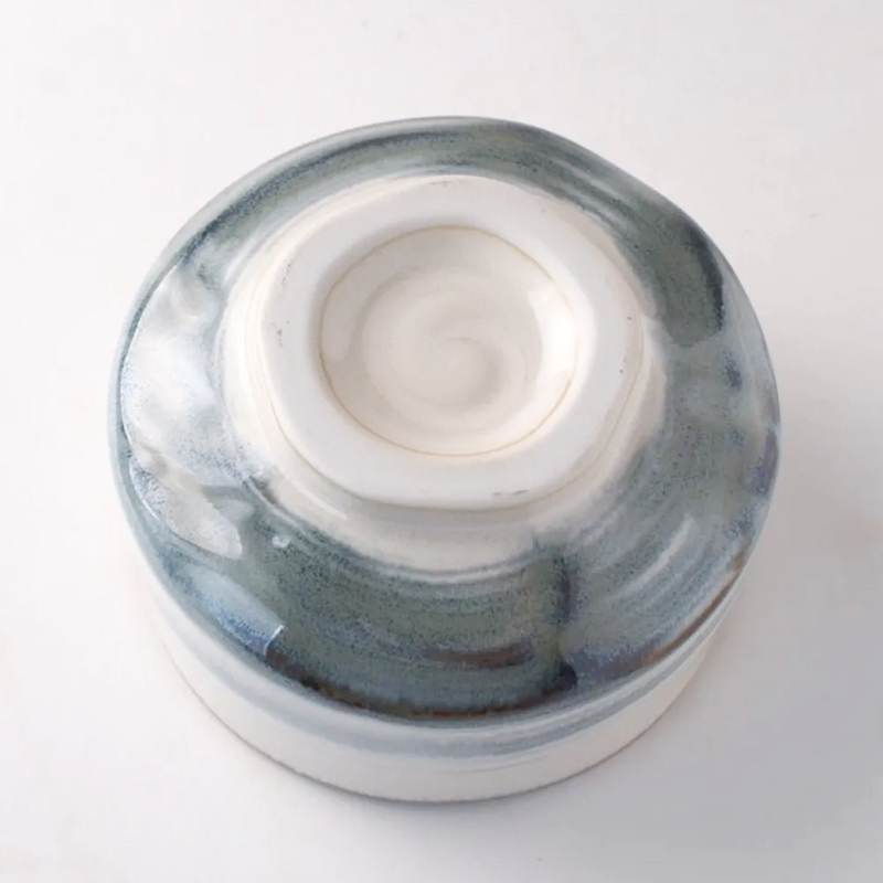 Base of Harukasumi matcha bowl showing hand-glazed foot ring and kiln marks.

