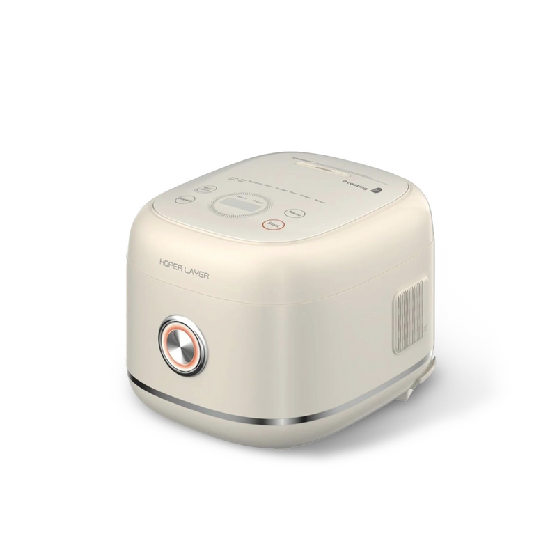 The Hoper Layer 6-cup stainless steel rice cooker, showing its minimalist cream-coloured design, top control panel, and large front button with a rose gold accent.
